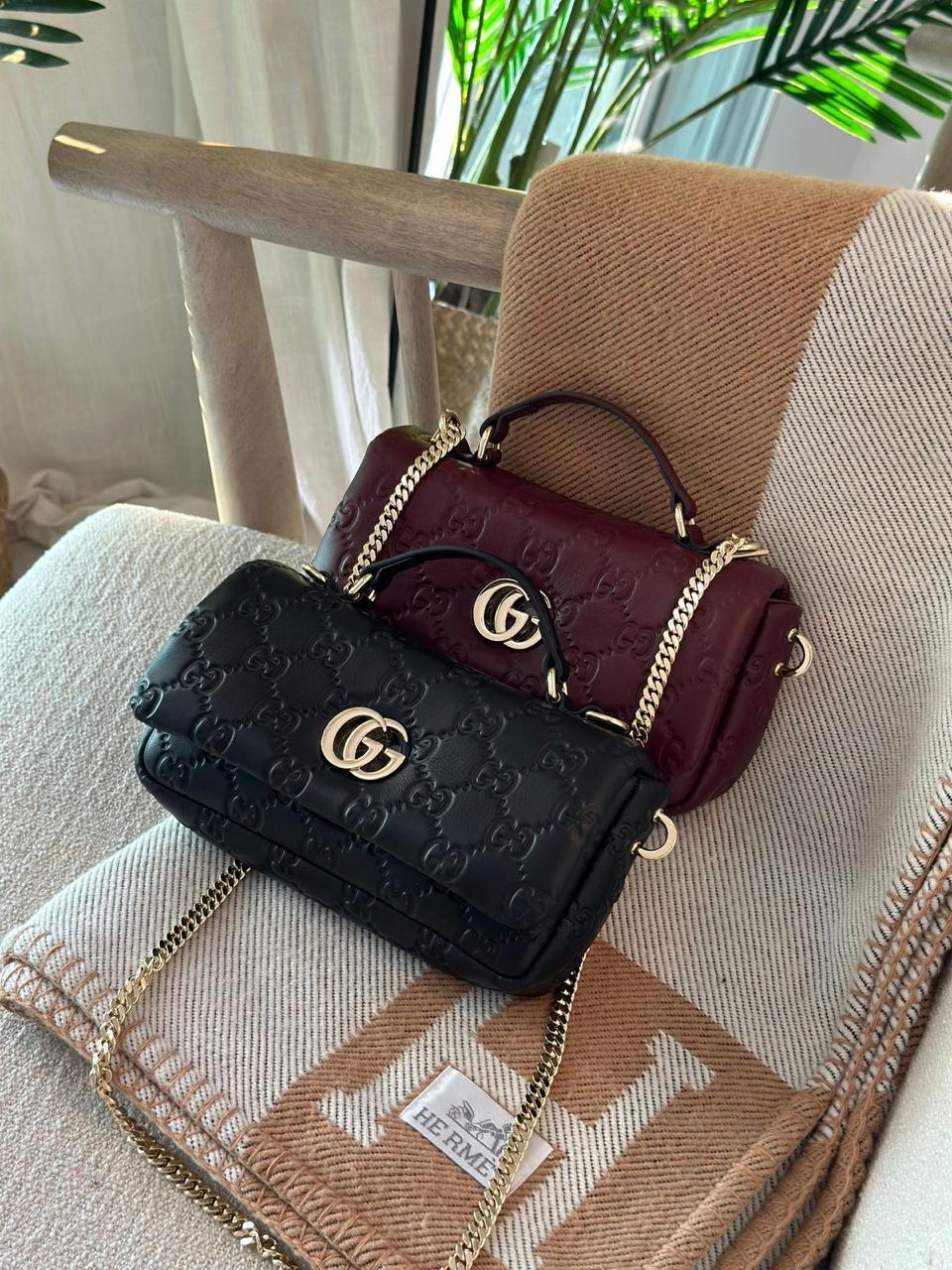 This is a Gucci GG Milano mini top handle bag