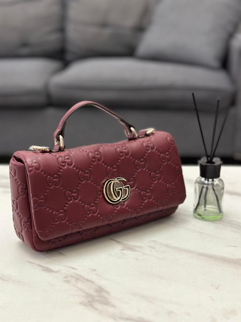 This is a Gucci GG Milano mini top handle bag