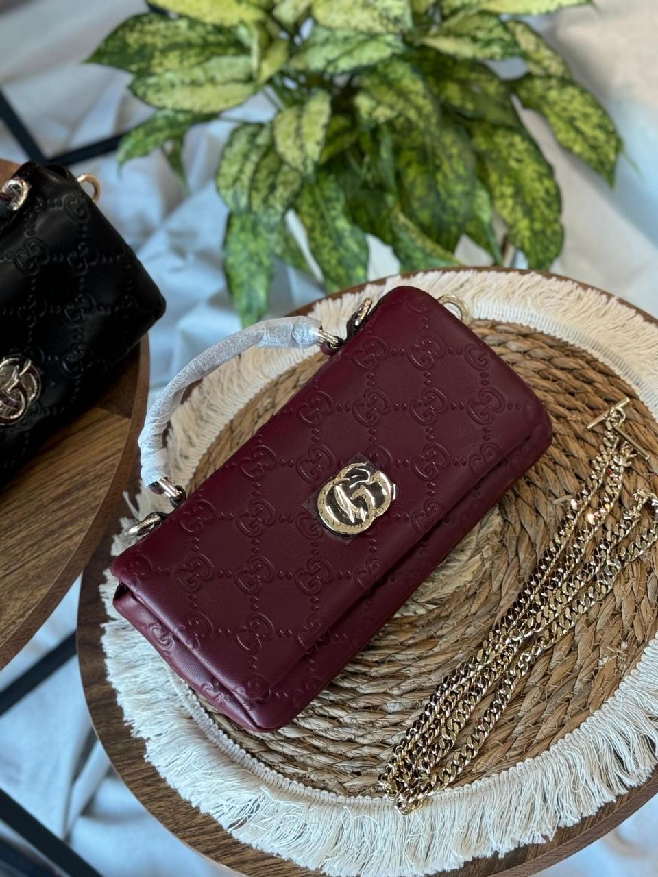 This is a Gucci GG Milano mini top handle bag